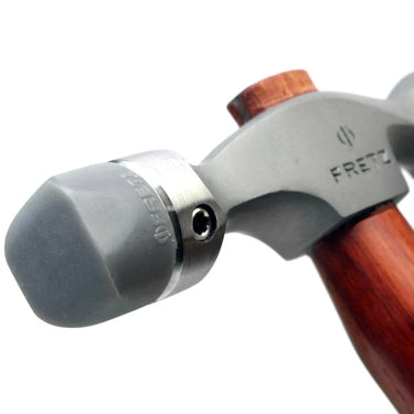 Macro close-up of rectangular flat nylon insert secured with set screw on Fretz hammer.