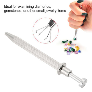 TSK gem stone holder tool with 4 open prongs next to loose diamonds and colorful gemstones.