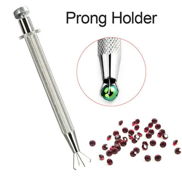 TSK prong holder tool with loose red faceted stones and circular inset holding a round bead.