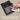 Touching pen probe to metal; LED indicates karat value or Platinum (PT).