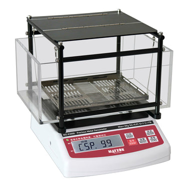 Three-quarter view of the MZ-K3000 precious metal densimeter with empty testing racks and an active digital screen.