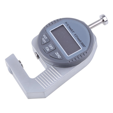 A high angle diagonal shot of the digital micrometer gauge showing the buttons and blank screen.