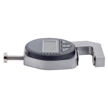 A horizontal profile view of the slim electronic thickness gauge lying flat on a white surface.