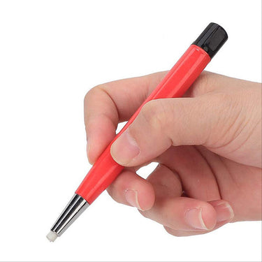 A hand holding a red fiberglass scratch brush pen, demonstrating its ergonomic design for precision work.