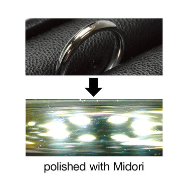 Shiny jewelry surface professionally polished with Midori green compound for a mirror finish.
