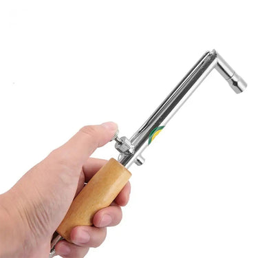 Hand holding jewelry soldering blowpipe torch adjusting gas regulation valve control knob.