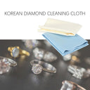 Blue and white Korean Diamond Cleaning Cloths displayed with various diamond rings.