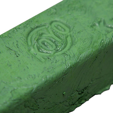 Detailed view of the KOYO logo engraved on the surface of the green polishing compound.