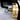 Close up view of the internal brass rotary chuck assembly holding pin fixtures inside the machine