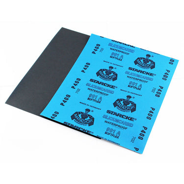 A sheet of blue Matador P400 grit waterproof silicon carbide wet dry sandpaper showing the dark abrasive side