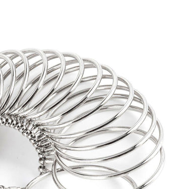 A row of silver metal bangle measuring loops arranged in an overlapping arch formation.
