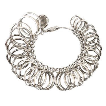 Full view of a silver ring sizer tool spread open in a circular shape.