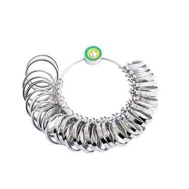Hands holding the TSK metal ring sizer set and fitting a gauge onto a finger to measure size.
