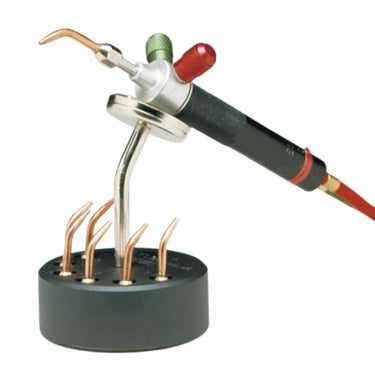 Angled view of Miller Smith magnetic stand with The Little Torch and numbered tip organizer holes.