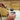 Jeweler using Miller Smith The Little Torch with micro flame for precision jewelry soldering on a soldering block.