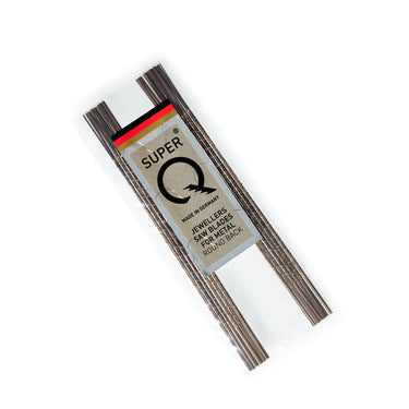 Multiple loose gross bundles of premium German NIQUA Super Q round back metal-cutting piercing saw blades.