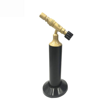 Full view of the black and brass ORCA Hobby MP99 portable gas micro torch resting on its circular bench stand.