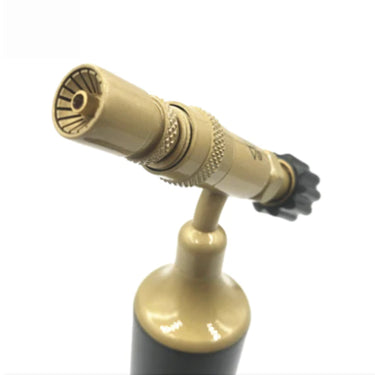 Close-up perspective view focusing on the internal grooves of the brass burner nozzle tip on the ORCA MP99 torch.