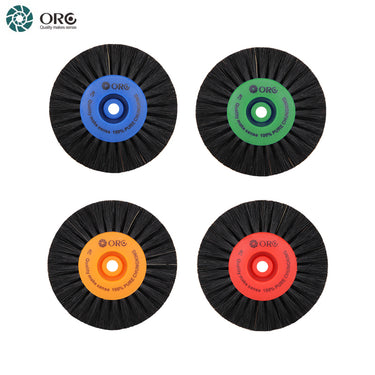 Four ORO 4C 100% pure black Chungking bristle wheels with blue, green, orange, and red plastic centers.