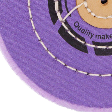Close-up of the concentric stitching and soft berry fabric on an ORO jewelry polishing buff.