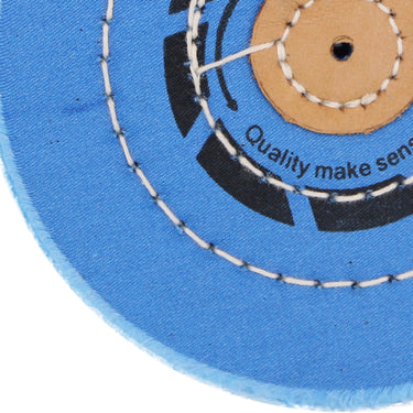 Close-up of the concentric stitching and high-density blue fabric on an ORO jewelry polishing buff.