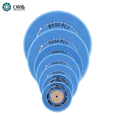 Stacked ORO blue muslin buffs showing the complete size range of 50-ply professional polishing wheels.