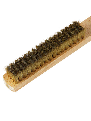 Close-up angled view of the dense brass wire bristles tufted into an ORO wooden handle scratch brush.