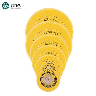 Stacked ORO light yellow muslin buffs showing a wide range of 50-ply diameters for professional metal finishing.