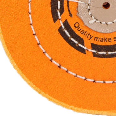Close-up of the concentric circular stitching on an ORO dark yellow buff designed for high-hardness polishing.