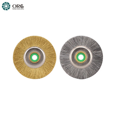 A crimped brass wire wheel brush alongside a crimped steel wire wheel brush with reinforced metal cores.