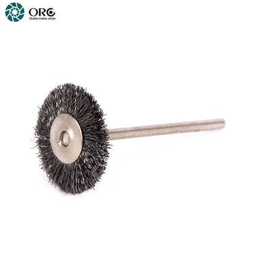 A small rotary carbon steel wire brush wheel with a long mounting mandrel for jewelry detailing.