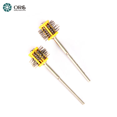 A pair of yellow-hubbed ORO MiniMat texturing brushes showcasing the steel wire pins used for jewelry finishing.