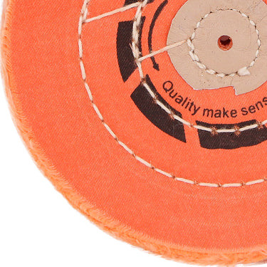 Close-up of the concentric stitching and durable orange fabric on an ORO professional polishing buff.