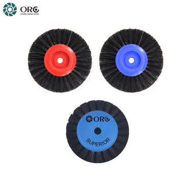 Three ORO dental laboratory polishing brushes featuring red, blue, and light blue plastic hub cores.
