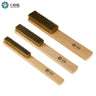 Three different sizes of ORO brass wire scratch brushes with wooden handles arranged diagonally on white background.