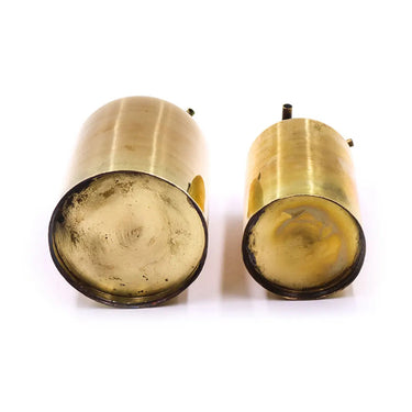 Bottom view of small and large single orifice brass petrol gas tanks for jewelry welding.