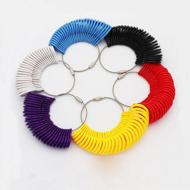 Six multi-colored plastic ring sizer sets arranged in a circle on a white background.