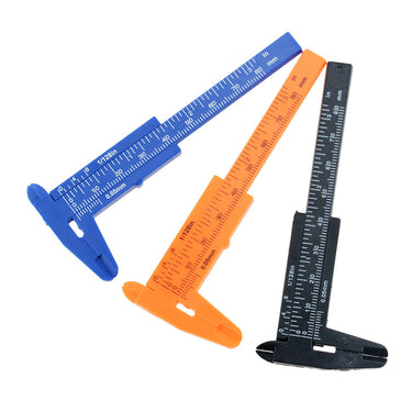 Alternative diagonal view of blue orange and black 0-80mm mini plastic vernier calipers.