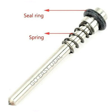 Internal hammer handpiece piston stylus showing attached spring and rubber seal ring.
