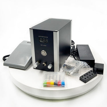 Black HH-AT01 pneumatic jewelry engraver machine with foot pedal, handpiece, and accessories.