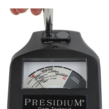 Calibrating the Presidium Gem Tester II by touching the probe to the built-in test disc.