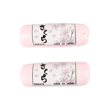 Horizontal view of Sakura pink polishing compound bars with floral packaging.