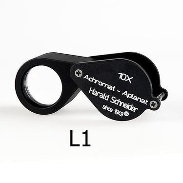 Closed Harald Schneider L1 18mm triplet loupe with matte black housing and "since 1949" branding.