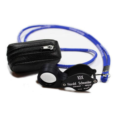 Harald Schneider L1 10x loupe kit including the blue neck lanyard and black leather protective zipper pouch.