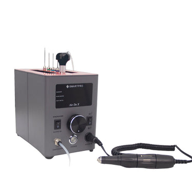 Angled view of SmartPro Air Do X pneumatic engraver connected to a micromotor handpiece.