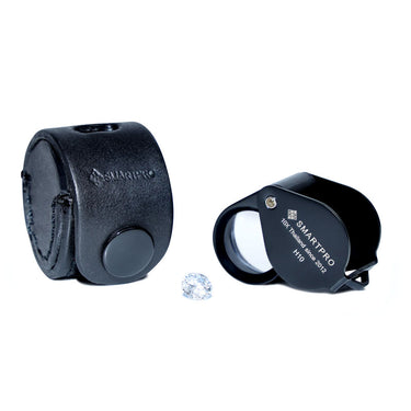 SmartPro H10 10X loupe with its black leather case and a loose brilliant-cut diamond.