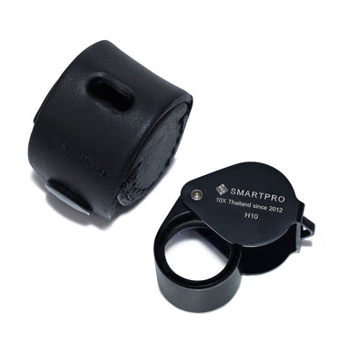 SmartPro H10 10X Triplet Loupe displayed next to its protective black leather carrying case.