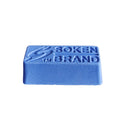 Close-up of Soken blue polishing paste bar showing the solid compound texture.
