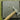 A steel bench block resting on a leather sandbag with silver jewelry rings and a chasing hammer.