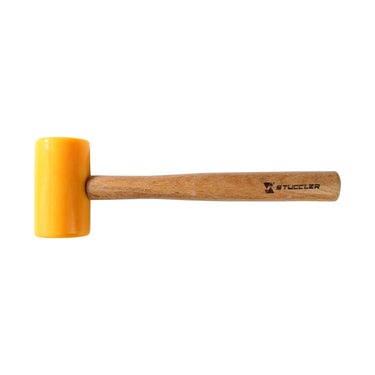 Side view of a Stuccler polyurethane mallet with a yellow head lying horizontally on a white background.